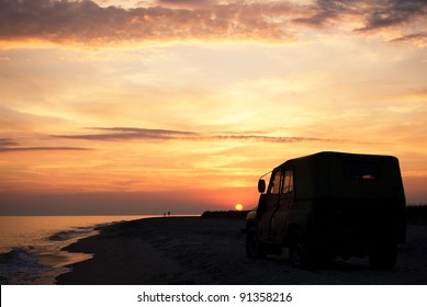 People On The Beach At Sunset Time, Parked Car