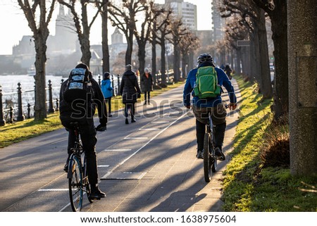 People on bicycle near Rhine river