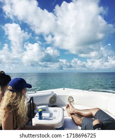 People on a fishing boat cruising through Islamorada Key in the Florida Keys on a beautiful sunny day. 