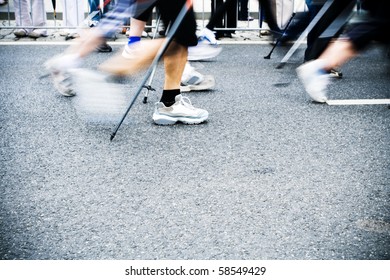 People On Nordic Walking Race On City Streets