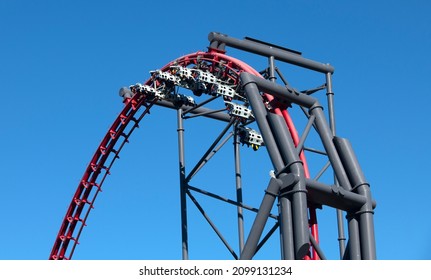 People On A Roller Coaster Ride And Blue Sky. Six Flags Magic Mountain Theme Amusement Park 