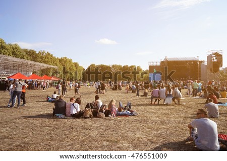 People at open air concert on sunny day