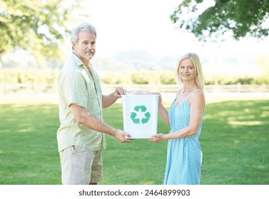 People, park and recycling bin for earth, cleanup or eco friendly growth for clean nature. Couple, portrait and smile for sustainability, ecology or responsible trash removal for hope or conservation - Powered by Shutterstock