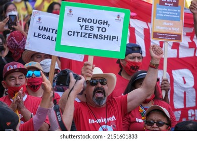 People Participate In The Annual May Day March In Downtown Los Angeles, Sunday, May 1, 2022. 