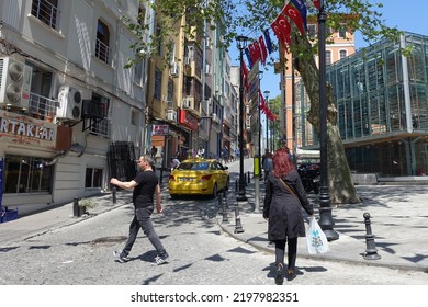 People Pass Along A Street In The Old City Centre On April 23, 2018 In Istanbul, Turkey.