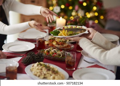 People Passing Plate With Christmas Carp