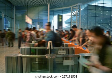 People Passing Through Automatic Ticket Gate (blurred Motion)