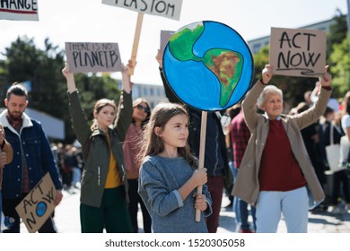 People with placards and posters on global strike for climate change. - Powered by Shutterstock