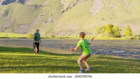 People Play In Badminton Outdoors