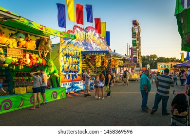 People Play Carnival Games At The State Fair