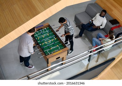 People Playing Enjoying Foosball Table Soccer Game Recreation Leisure - Powered by Shutterstock