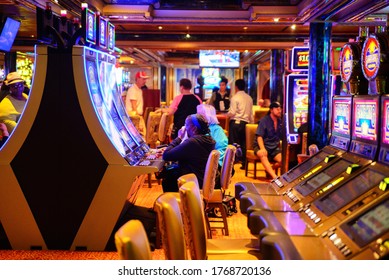 People Are Playing Gambling On A Game King Casino Slots On Cruise Ship, Carnival Cruise Lines, Carnival Breeze, Caribbean Islands, June 12, 2020