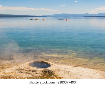 People Playing Kayak In Yellowstone Lake Of Yellowstone National Park At Wyoming