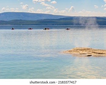 People Playing Kayak In Yellowstone Lake Of Yellowstone National Park At Wyoming