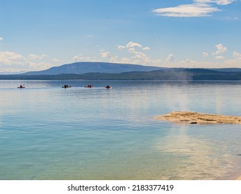 People Playing Kayak In Yellowstone Lake Of Yellowstone National Park At Wyoming