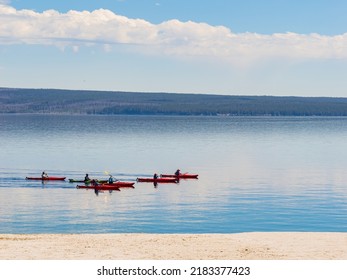 People Playing Kayak In Yellowstone Lake Of Yellowstone National Park At Wyoming