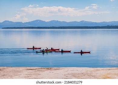 People Playing Kayak In Yellowstone Lake Of Yellowstone National Park At Wyoming