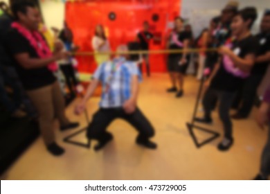 People Playing Limbo Rock. Out Of Focus. Blur Image