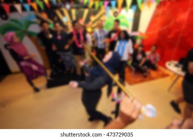 People Playing Limbo Rock. Out Of Focus. Blur Image