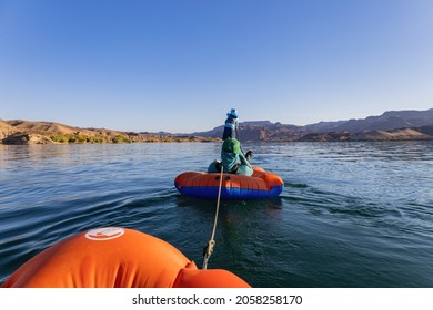 People Playing Stand Up Paddle In Lake Mead At Nevada