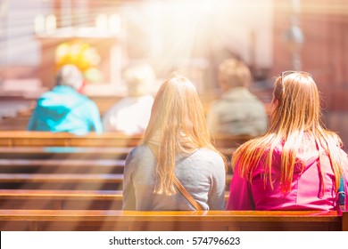 People Praying In A Church