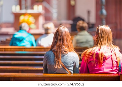 People Praying In A Church