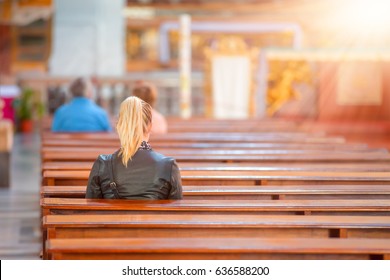 People Praying In A Church