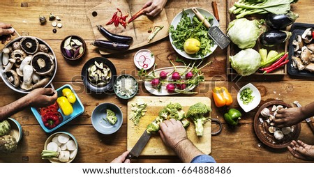 Similar – Image, Stock Photo Female hands making chicken skewers with vegetables for grilling