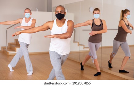 People In Protective Masks Learning Swing Steps At Dance Class