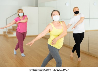 People In Protective Masks Learning Swing Steps At Dance Class