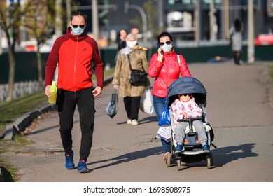 People In Protective Masks As A Preventive Measure Against The Coronavirus COVID - 19 On Street In Kyiv, Ukraine. April 2020