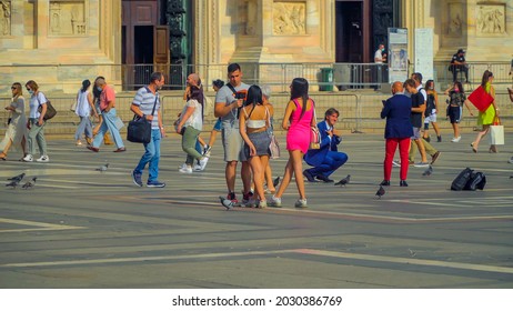 People in protective masks and without them. tourists and locals in the gallery Vittorio Emanuele 2. Crowds of people. Shopping. Opening borders. Covid epidemic. Milan, Italy - August 2021:  - Shutterstock ID 2030386769
