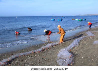 the people are pulling their fishing nets