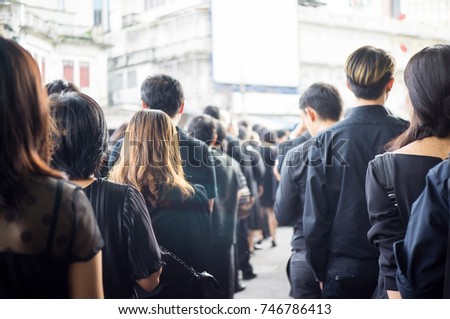 People queue dedicated to mourn the king of Thailand in Bangkok Railway Station
