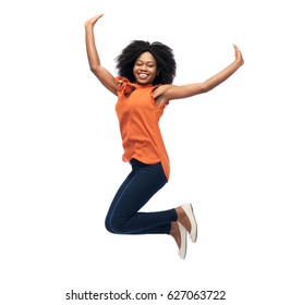 People, Race, Ethnicity And Motion Concept - Happy African American Young Woman Jumping Over White