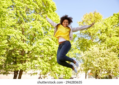 People, Race, Ethnicity And Portrait Concept - Happy African American Young Woman In Summer Park