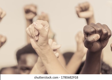 People Raised Fist Air Fighting For Their Rights. Labor Movement, Election Movement, No Racism And Union Concept. Image