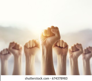 People Raised Fist Air Fighting For Their Rights With Sunlight Effect,  Labor Movement, Election Movement, Copy Space