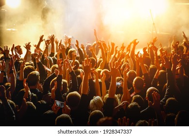 People With Raised Hands At A Public Event. Gathering In Concert Hall