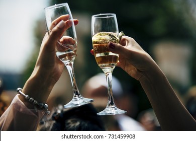 People Raising A Toast With Champaign  Glass. 