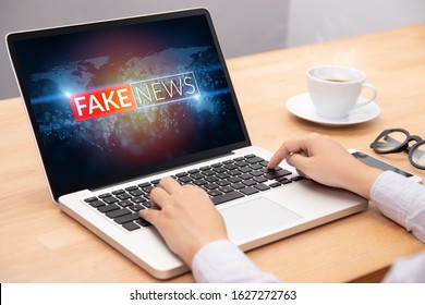 People Reading Fake News Or HOAX On Internet Content Via Laptop 