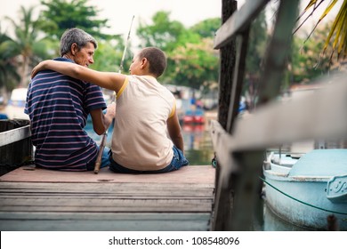 People And Recreation, Senior Man And Boy Fishing Together On Lake