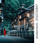 people in red clothes walking in ginzan onsen japan