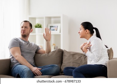 People, Relationship Difficulties, Conflict And Family Concept - Unhappy Couple Having Argument At Home