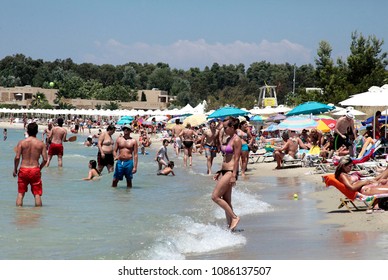 People Relaxing On The Beach In Sani Beach, Halkidiki, Greece On Jul. 21, 2012