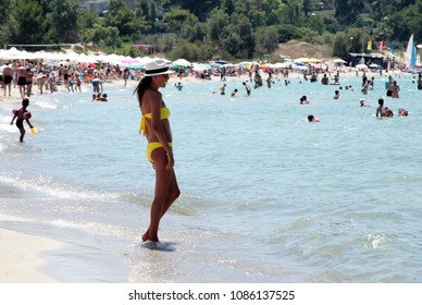 People Relaxing On The Beach In Sani Beach, Halkidiki, Greece On Jul. 21, 2012