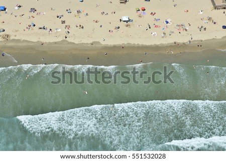 Similar – Aerial View From Flying Drone Of People Crowd Relaxing On Algarve Beach In Portugal