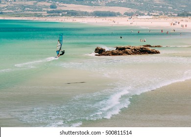 People resting at beach in Tarifa, Spain. Tarifa is most popular places in Spain for vacation