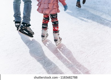 People ride on the skating rink on the ice rink during the Christmas holidays. Sports and fun pastime.