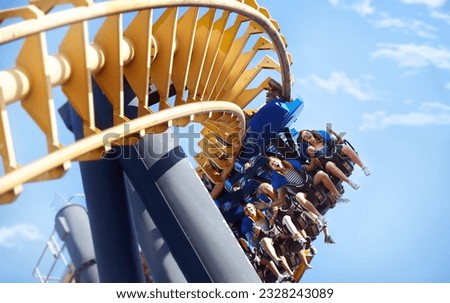 People riding amusement park ride